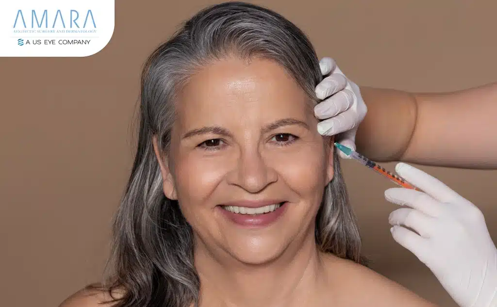A Happy women getting Botox treatment to her face